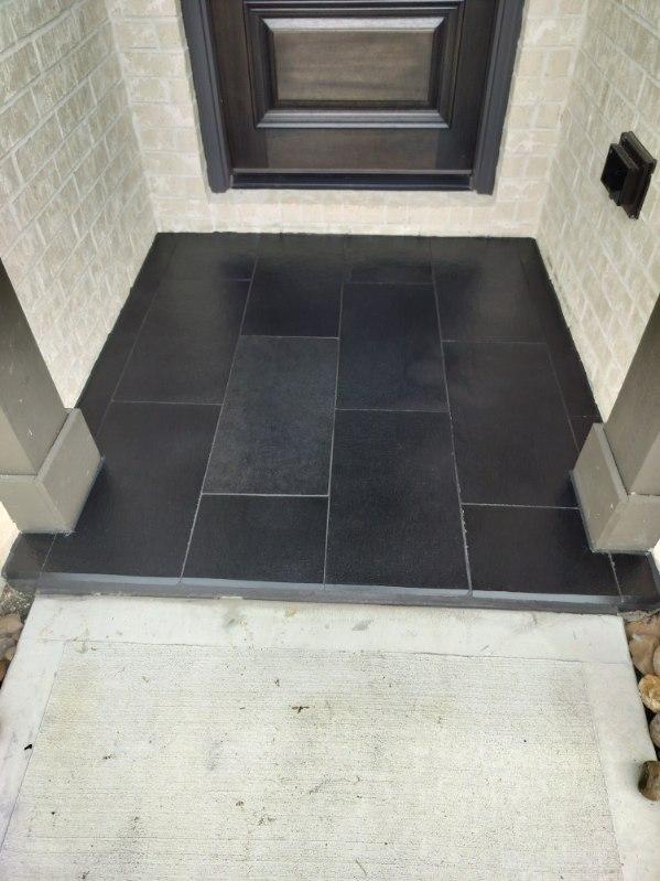 dark grey outdoor entryway tile installation, wfa's custom hardwood floors, houston texas